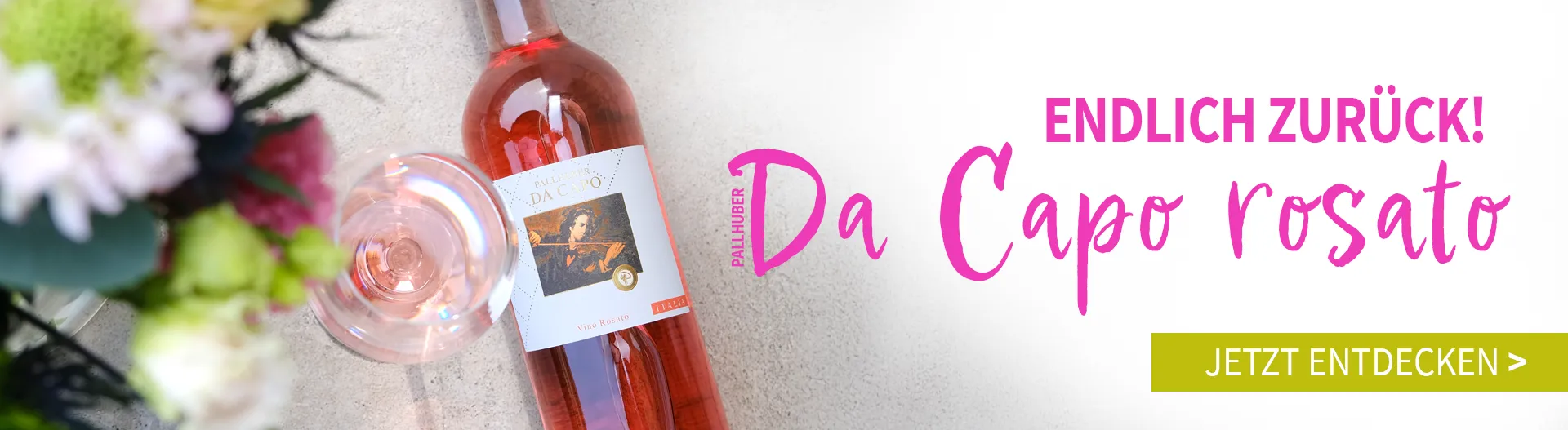 Eine Flasche Pallhuber Da Capo rosso mit Blumen